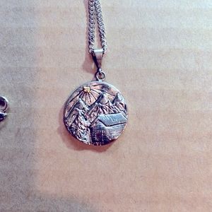 Sterling silver necklace with a small gold nugget. New